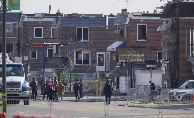 Shown are damaged structures in the aftermath of a fatal small plane crashed in Philadelphia, Monday, Feb. 3, 2025. (AP Photo/Matt Rourke)