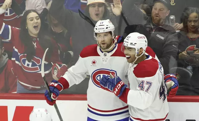 Montreal Canadiens' Josh Anderson (17) celebrates his goal with teammate Jayden Struble (47) during second period NHL hockey action against the Ottawa Senators in Ottawa on Saturday, Feb. 22, 2025. (Patrick Doyle/The Canadian Press via AP)