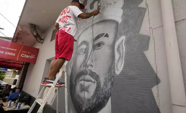 A mural of Brazilian soccer player Neymar is painted next to Vila Belmiro stadium in Santos, Brazil, Friday, Jan. 31, 2025, before a ceremony presenting him as a new Santos FC player. (AP Photo/Andre Penner)