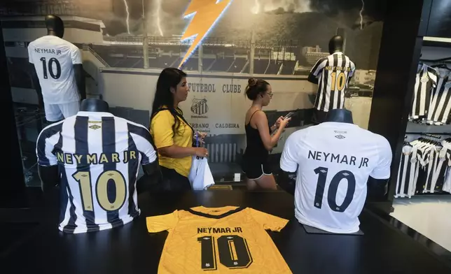 Jerseys of Brazilian soccer player Neymar are displayed at the Santos FC club store at Vila Belmiro Stadium before A ceremony presenting him as the club's new player in Santos, Brazil, Friday, Jan. 31, 2025. (AP Photo/Andre Penner)
