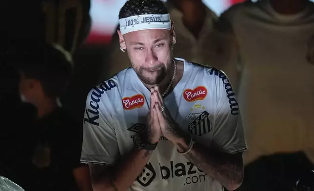 Brazilian soccer player Neymar reacts during his presentation ceremony after signing a six-month contract with Santos FC at Vila Belmiro Stadium in Santos, Brazil, Friday, Jan. 31, 2025. (AP Photo/Andre Penner)