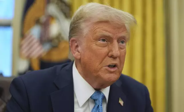 President Donald Trump speaks to reporters as he signs executive orders in the Oval Office of the White House, Friday, Jan. 31, 2025, in Washington. (AP Photo/Evan Vucci)