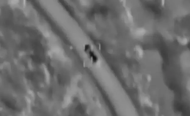 This image from Israeli Defense Forces drone video shows a car in crosshairs, moments before it was destroyed in the town of Ainata, southern Lebanon, near the border with Israel, on Sunday, Nov. 5, 2023. (IDF via AP)