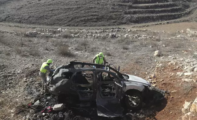 The remains of a Hyundai SUV are seen in the town of Ainata, a Lebanese border village with Israel in south Lebanon, Monday, Nov. 6, 2023, after Samira Ayoub, and her three granddaughters, Rimas, 14; Taline, 12, and Liane, 10, were killed in the car during an Israeli airstrike the previous evening. (AP Photo/Mohammed Zaatari)
