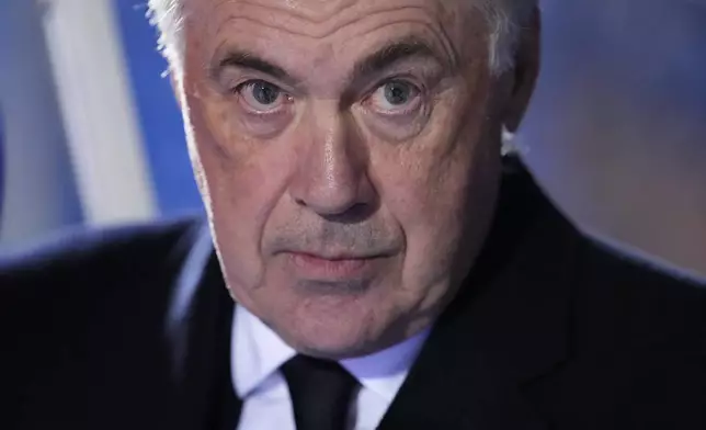 Real Madrid's head coach Carlo Ancelotti sits at the bench prior a Spanish Copa del Rey, or King's Cup, quarter-final soccer match between CD Leganes and Real Madrid at Butarque stadium, in Leganes, outside Madrid, Wednesday, Feb. 5, 2025. (AP Photo/Manu Fernandez)