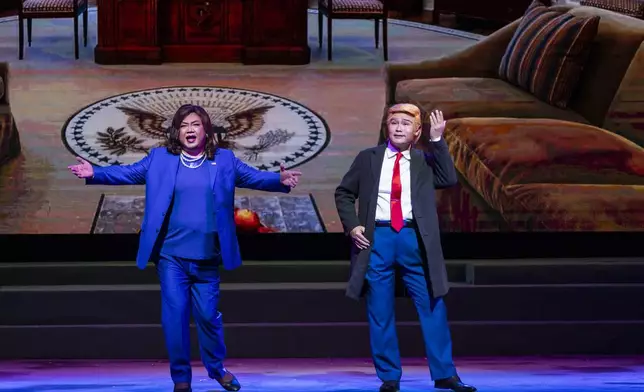 Actor Roger Chan portraying U.S. former Vice President Kamala Harris, left, and Lung Koon-tin playing the part of U.S. President Donald Trump perform in a Cantonese opera at the Sunbeam Theatre in Hong Kong, Monday, Feb. 3, 2025. (AP Photo/Chan Long Hei)