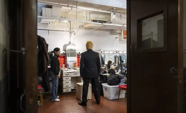 Cantonese opera actor Lung Koon-tin portraying U.S. President Donald Trump prepares for the “Trump on Show” production at the Sunbeam Theatre in Hong Kong, Monday, Feb. 3, 2025. (AP Photo/Chan Long Hei)