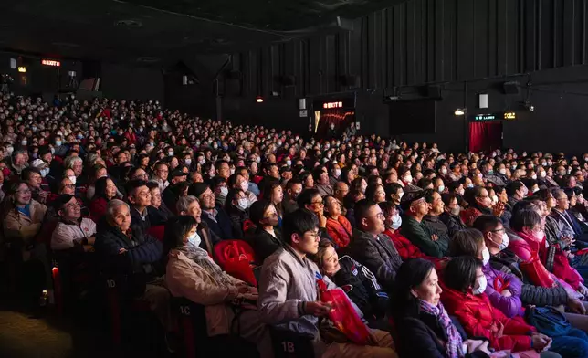 A packed audience watches the Cantonese opera production “Trump on Show” at the Sunbeam Theatre in Hong Kong, Monday, Feb. 3, 2025. (AP Photo/Chan Long Hei)