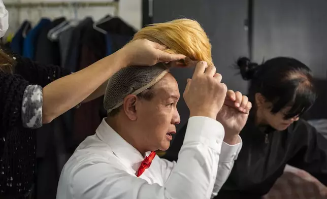 Cantonese opera actor Lung Koon-tin portraying U.S. President Donald Trump prepares to perform in the “Trump on Show” production at the Sunbeam Theatre in Hong Kong, Monday, Feb. 3, 2025. (AP Photo/Chan Long Hei)
