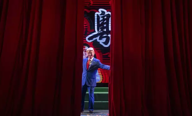 Cantonese opera actor Lung Koon-tin portraying U.S. President Donald Trump gestures at the end of the “Trump on Show” production at the Sunbeam Theatre in Hong Kong, Monday, Feb. 3, 2025. (AP Photo/Chan Long Hei)