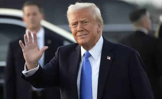 President Donald Trump waves after arriving on Air Force One at Palm Beach International Airport in West Palm Beach, Fla., Friday, Feb. 7, 2025. (AP Photo/Ben Curtis)