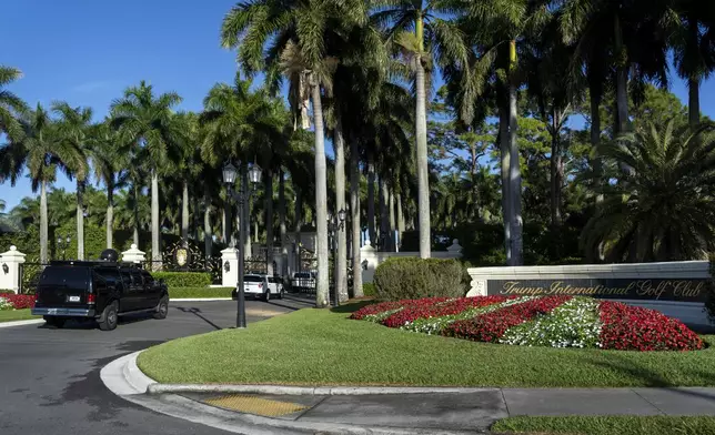 The motorcade of President Donald Trump arrives at the Trump International Golf Club, Sunday, Feb. 9, 2025, in West Palm Beach, Fla. (AP Photo/Ben Curtis)