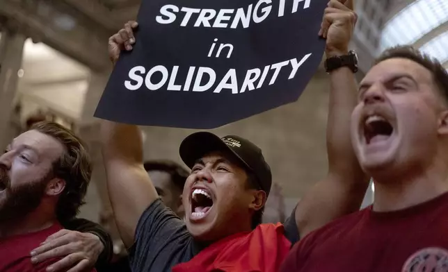 Professional firefighters of Utah members Donavan Minutes, left, Branden Cresencia and Bennett Lloyd chant during the Solidarity Rally in opposition to "HB 267 Public Sector Labor Union Amendments" at the Capitol in Salt Lake City, Utah, on Friday, Feb. 7, 2025. (Laura Seitz/The Deseret News via AP)