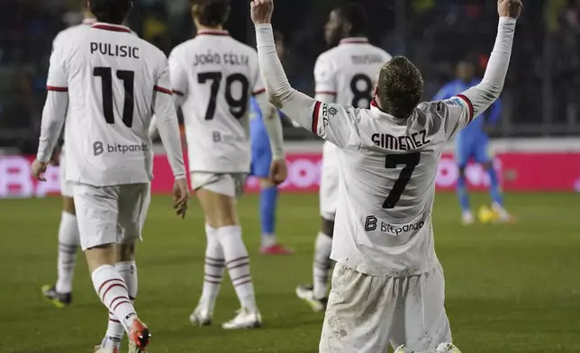Milan's Tomas Santiago Gimenez celebrates after scoring his side's second goal during the Serie A soccer match between Empoli and Milan at the Carlo Castellani stadium in Empoli, Italy, Saturday, Feb. 8, 2025. (Marco Bucco/LaPresse via AP)