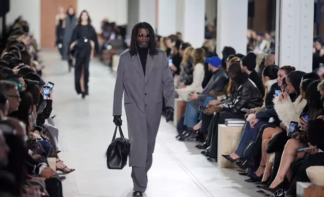 Models walk the runway during the Michael Kors Fall/Winter 2025 fashion show as part of New York Fashion Week on Tuesday, Feb. 11, 2025, at Terminal Warehouse in New York. (Photo by Charles Sykes/Invision/AP)