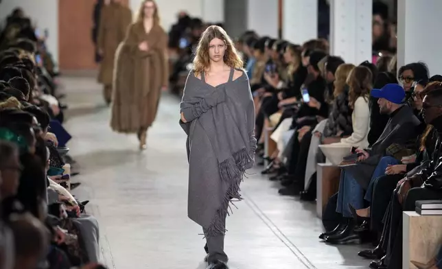 Models walk the runway during the Michael Kors Fall/Winter 2025 fashion show as part of New York Fashion Week on Tuesday, Feb. 11, 2025, at Terminal Warehouse in New York. (Photo by Charles Sykes/Invision/AP)
