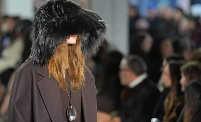 A model walks the runway during the Michael Kors Fall/Winter 2025 fashion show as part of New York Fashion Week on Tuesday, Feb. 11, 2025, at Terminal Warehouse in New York. (Photo by Charles Sykes/Invision/AP)