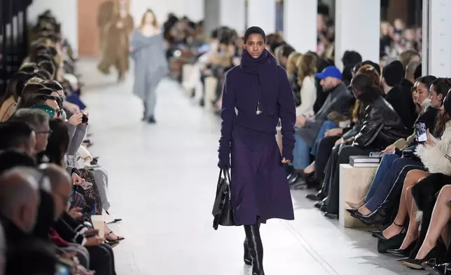 A model walks the runway during the Michael Kors Fall/Winter 2025 fashion show as part of New York Fashion Week on Tuesday, Feb. 11, 2025, at Terminal Warehouse in New York. (Photo by Charles Sykes/Invision/AP)