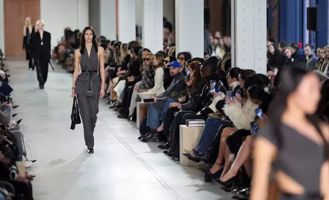 Models walk the runway during the Michael Kors Fall/Winter 2025 fashion show as part of New York Fashion Week on Tuesday, Feb. 11, 2025, at Terminal Warehouse in New York. (Photo by Charles Sykes/Invision/AP)