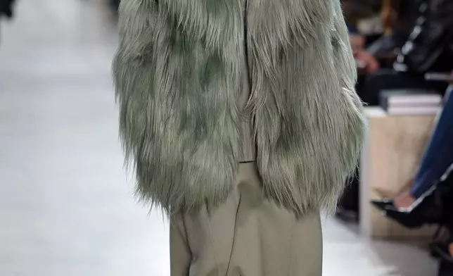 A model walks the runway during the Michael Kors Fall/Winter 2025 fashion show as part of New York Fashion Week on Tuesday, Feb. 11, 2025, at Terminal Warehouse in New York. (Photo by Charles Sykes/Invision/AP)
