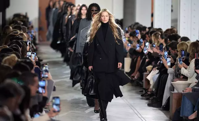 Models walk the runway during the Michael Kors Fall/Winter 2025 fashion show as part of New York Fashion Week on Tuesday, Feb. 11, 2025, at Terminal Warehouse in New York. (Photo by Charles Sykes/Invision/AP)