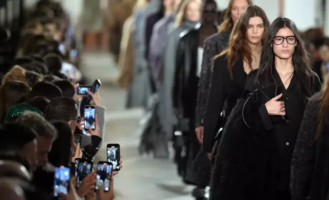 Models walk the runway during the Michael Kors Fall/Winter 2025 fashion show as part of New York Fashion Week on Tuesday, Feb. 11, 2025, at Terminal Warehouse in New York. (Photo by Charles Sykes/Invision/AP)