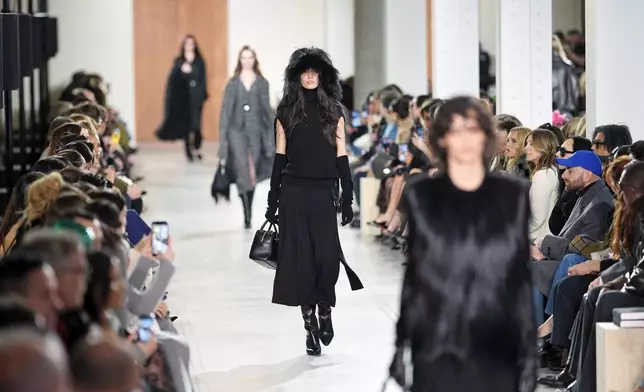 Models walk the runway during the Michael Kors Fall/Winter 2025 fashion show as part of New York Fashion Week on Tuesday, Feb. 11, 2025, at Terminal Warehouse in New York. (Photo by Charles Sykes/Invision/AP)