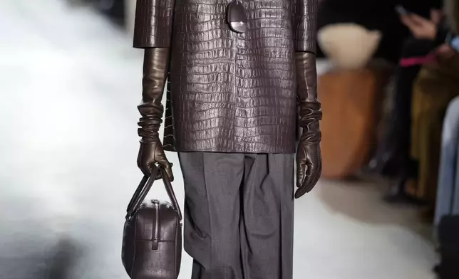 A model walks the runway during the Michael Kors Fall/Winter 2025 fashion show as part of New York Fashion Week on Tuesday, Feb. 11, 2025, at Terminal Warehouse in New York. (Photo by Charles Sykes/Invision/AP)