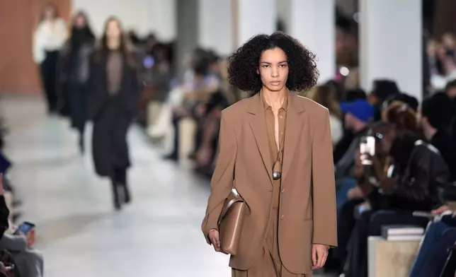 Models walk the runway during the Michael Kors Fall/Winter 2025 fashion show as part of New York Fashion Week on Tuesday, Feb. 11, 2025, at Terminal Warehouse in New York. (Photo by Charles Sykes/Invision/AP)