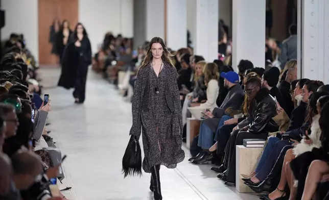 Models walk the runway during the Michael Kors Fall/Winter 2025 fashion show as part of New York Fashion Week on Tuesday, Feb. 11, 2025, at Terminal Warehouse in New York. (Photo by Charles Sykes/Invision/AP)