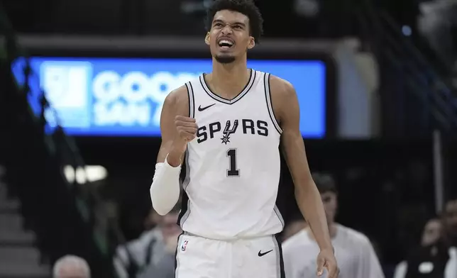 San Antonio Spurs center Victor Wembanyama reacts after a play during the second half of an NBA basketball game against the Milwaukee Bucks in San Antonio, Friday, Jan. 31, 2025. (AP Photo/Eric Gay)