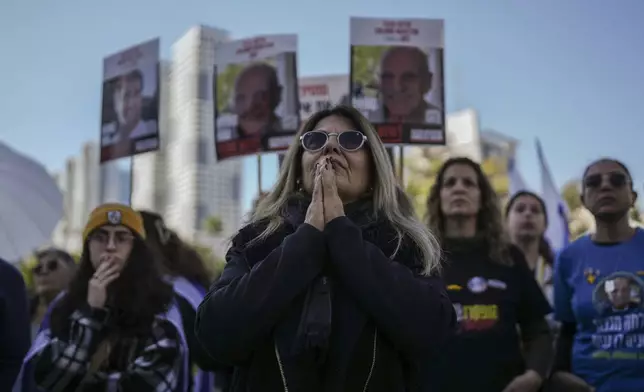 Israelis gather at Hostages Square, waiting for the release of Iair Horn, Sagui Dekel Chen, and Alexander (Sasha) Troufanov in Tel Aviv, Israel, Saturday, Feb. 15, 2025. (AP Photo/Oded Balilty)