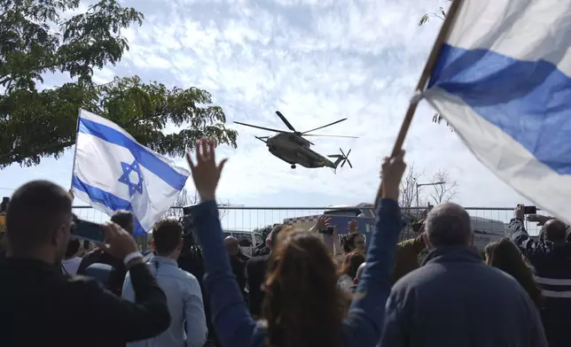 An Israeli military helicopter carrying two freed hostages from Hamas captivity in Gaza, American-Israeli Sagui Dekel Chen and Russian-Israeli Alexander (Sasha) Troufanov, arrives at the Sheba Hospital in Ramat Gan, Israel, Saturday, Feb. 15, 2025. (AP Photo/Ariel Schalit)