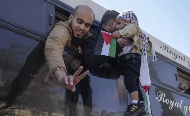 Freed Palestinian prisoners are greeted by relatives in Khan Younis, Gaza Strip, Saturday, Feb. 15, 2025, as they arrive in the Gaza Strip after being released from an Israeli prison following a ceasefire agreement between Hamas and Israel. (AP Photo/Abdel Kareem Hana)