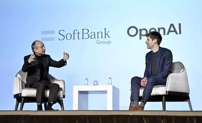SoftBank Chief Masayoshi Son, left, and OpenAI Chief Sam Altman hold a talk during an event for enterprises in Tokyo, in Tokyo, Monday, Feb. 3, 2025. (Kyodo News via AP)