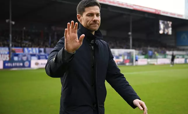 Leverkusen's head coach Xabi Alonso before the German Bundesliga soccer match between Holstein Kiel and Bayer 04 Leverkusen in Kiel, Germany, Saturday, Feb. 22, 2025. (Gregor Fischer/dpa via AP)