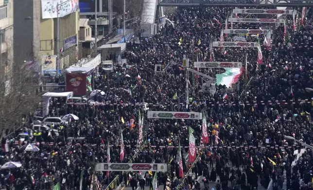 Iranians march during a rally commemorating anniversary of 1979 Islamic Revolution that toppled the late pro-U.S. Shah Mohammad Reza Pahlavi and brought Islamic clerics to power, in Tehran, Iran, Monday, Feb. 10, 2025. (AP Photo/Vahid Salemi)