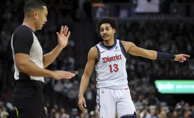 Washington Wizards guard Jordan Poole, right, argues a call with referee Kohn Conley during the first half of an NBA basketball game against the Minnesota Timberwolves, Saturday, Feb. 1, 2025, in Minneapolis. (AP Photo/Matt Krohn)