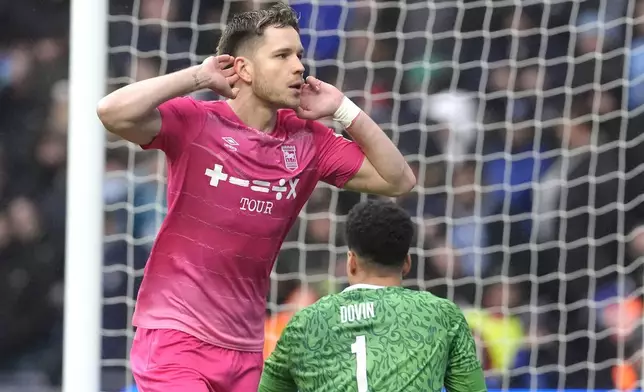 Ipswich Town's George Hirst celebrates scoring during the English FA Cup fourth round soccer match between Coventry City and Ipswich Town at the Coventry Building Society Arena, Coventry, England, Saturday Feb. 8, 2025. (Nick Potts/PA via AP)