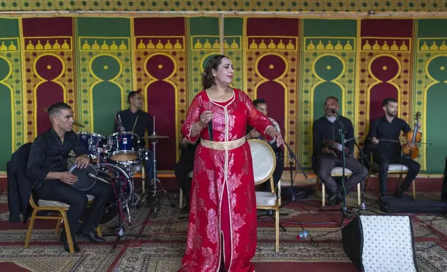 Cheikha folk singer Mbarka "Thouria" Moullablad gives a traditional performance known as Aita, in Sidi Yahya Zaer, south of the capital Rabat, Morocco, Monday, Jan. 27, 2025. (AP Photo/Mosa'ab Elshamy)