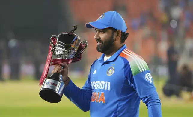 India's captain Rohit Sharma holds the trophy after winning one day international cricket series against England in Ahmedabad, India, Wednesday, Feb. 12, 2025. (AP Photo/ Ajit Solanki )