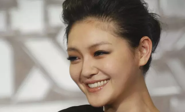 FILE - Taiwanese actress Barbie Hsu smiles during an event to promote her new movie "Future X-Cops," Monday, March 29, 2010, in Taipei, Taiwan. (AP Photo/Chiang Ying-ying, File)
