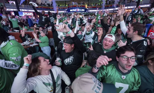 Philadelphia Eagles fans react to the Eagles first touchdown at the watch party for NFL football's Super Bowl 59 game against the Kansas City Chiefs, Sunday, Feb. 9, 2025, at Xfinity Live! Philadelphia. in Philadelphia. (AP Photo/Chris Szagola)