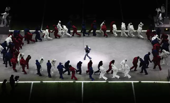 Kendrick Lamar performs during halftime of the NFL Super Bowl 59 football game between the Kansas City Chiefs and the Philadelphia Eagles, Sunday, Feb. 9, 2025, in New Orleans. (AP Photo/Charlie Riedel)