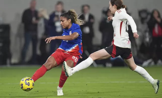United States forward Catarina Macario, left, shoots and misses as Japan defender Hikaru Kitagawa defends during the first half of a SheBelieves Cup women's soccer tournament match Wednesday, Feb. 26, 2025, in San Diego. (AP Photo/Gregory Bull)