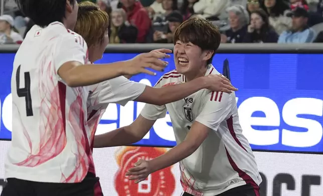 Japan defender Toko Koga, right, celebrates with teammates after scoring a goal against the United States during the second half of a SheBelieves Cup women's soccer tournament match Wednesday, Feb. 26, 2025, in San Diego. (AP Photo/Gregory Bull)