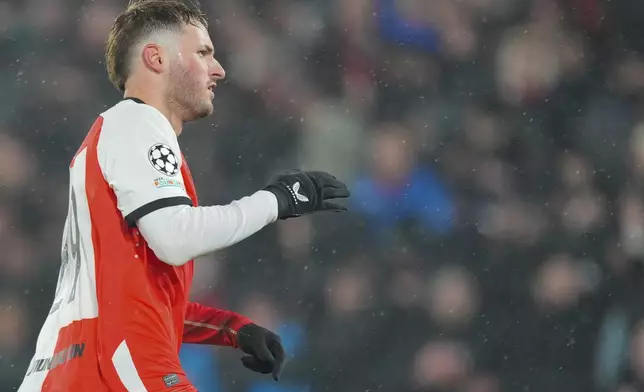 Feyenoord's Santiago Gimenez celebrates after scoring the opening goal during the Champions League opening phase soccer match between Feyenoord and Bayern Munich, at De Kuip Stadium, in Rotterdam, Netherlands, Wednesday, Jan. 22, 2025. (AP Photo/Peter Dejong)