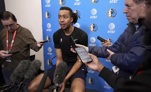 Dallas Mavericks newly-acquired player Moses Brown responds to question during a news conference after NBA basketball practice at the team's training facility in Dallas, Thursday, Feb. 20, 2025. (AP Photo/Tony Gutierrez)