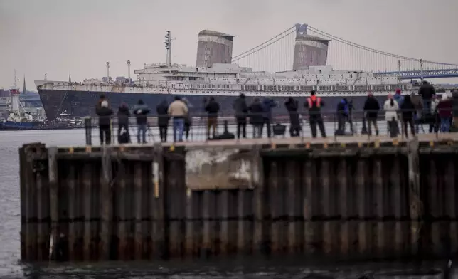 The SS United States is towed down the Delaware River between Pennsylvania and New Jersey, from Philadelphia, Wednesday, Feb. 19, 2025. (AP Photo/Matt Rourke)