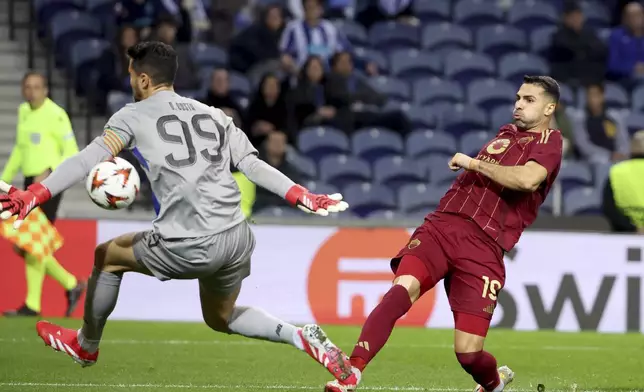 Roma's Zeki Celik scores the opening goal during the Europa League playoff first leg soccer match between FC Porto and AS Roma at the Dragao stadium in Porto, Portugal, Thursday, Feb. 13, 2025. (AP Photo/Luis Vieira)